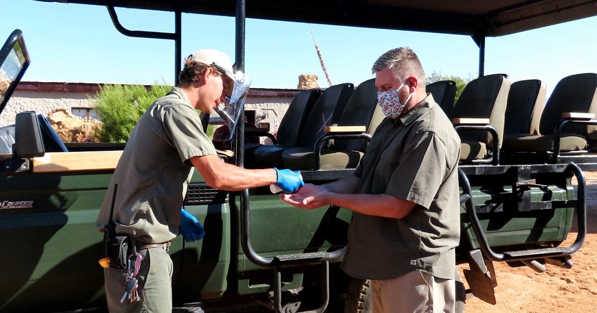 Sanitising guests hands before the Nature Drive